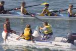 ID 3805 A Takapuna Grammar School eights rowing team with coach in close attendance, at practice on Aucklands' Waitemata Harbour, NZ. 